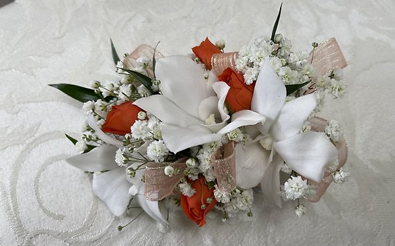 Dendrobium and spray rose corsage